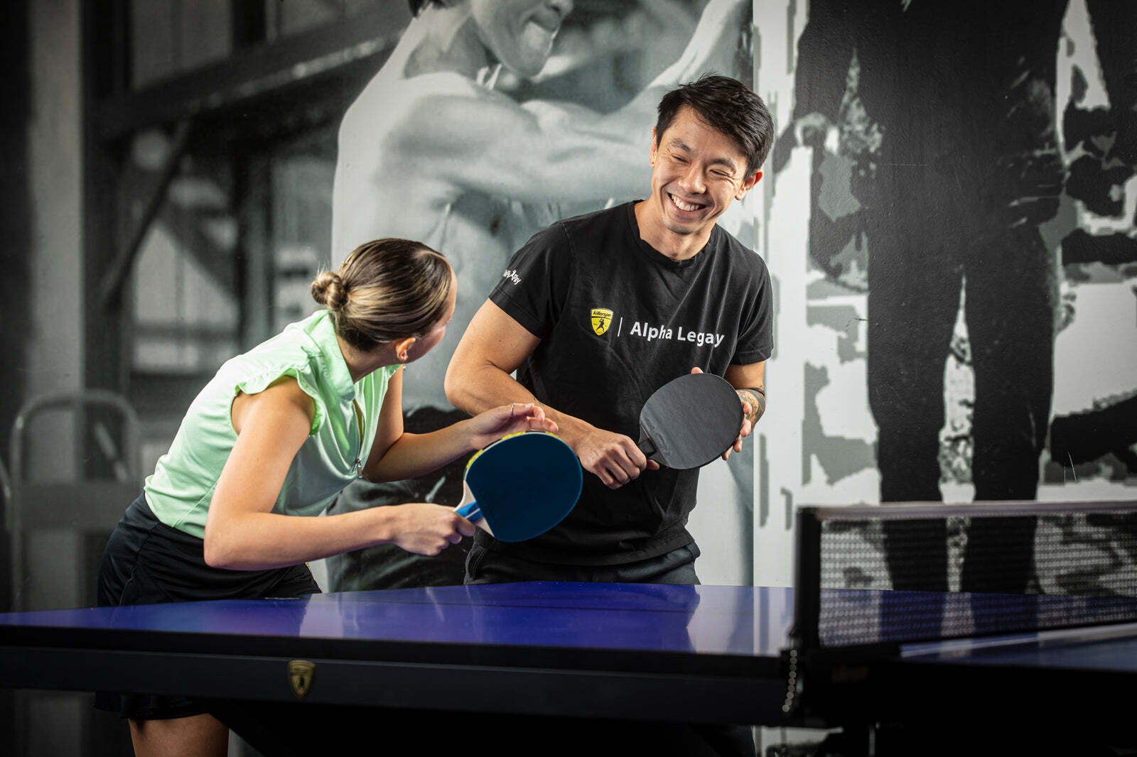 Two players in a table tennis rally